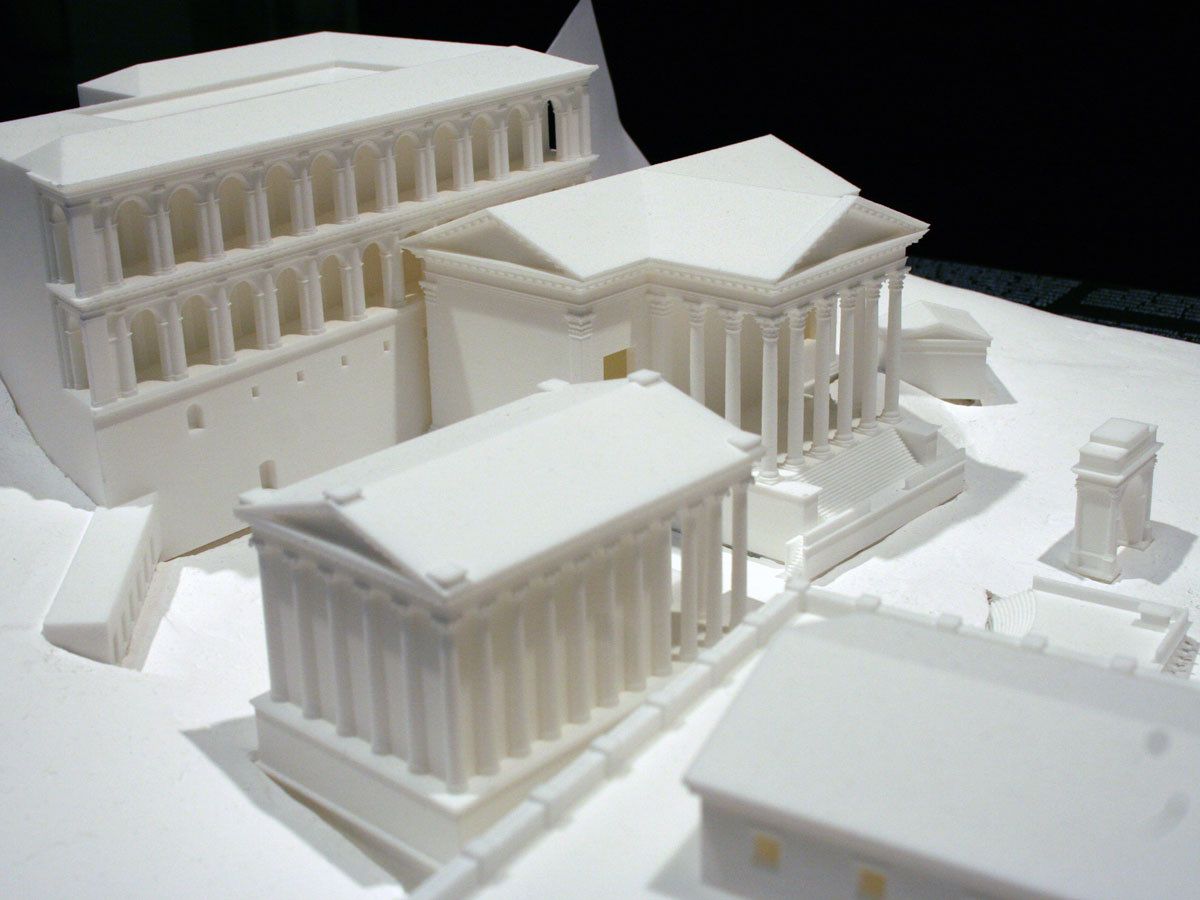 Close-up of a white 3D-printed model of the Roman Forum showing temples, columns and arcades